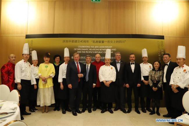 Chinese chefs pose for a group photo with chief guests at 