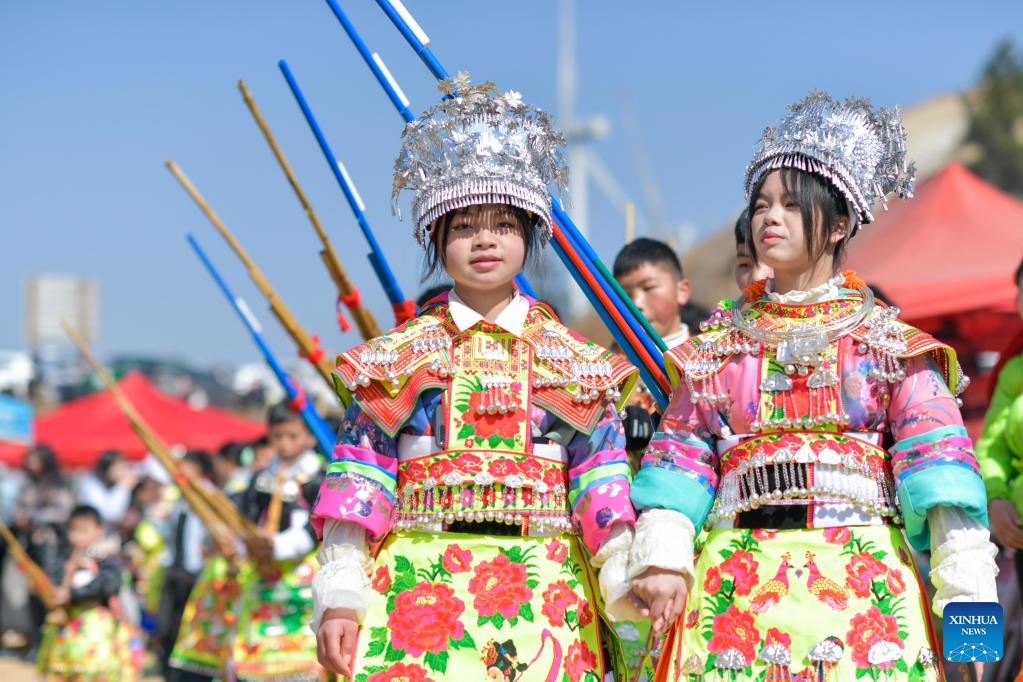 A Chinese villager of Miao ethnic group wearing traditional costumes  practises ''Miao stickfighting'', a unique martial art of the Miao Martial  Arts i Stock Photo - Alamy