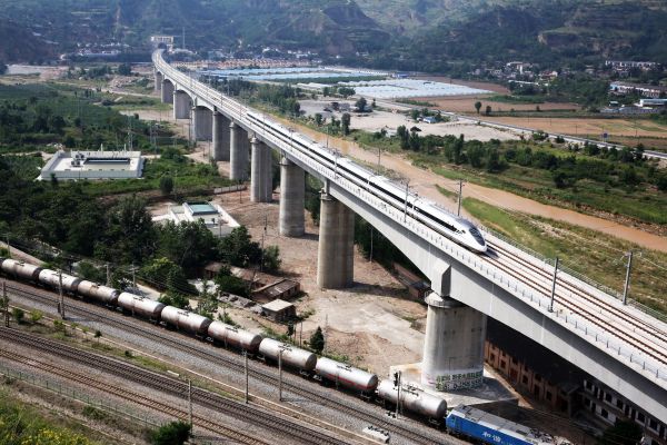 Photo taken on July 9, 2017 shows a bullet train running on a bridge in Tianshui, northwest China's Gansu Province.   (Li Zenghui/Xinhua)